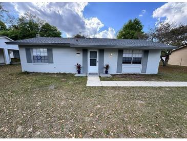 Charming single-story home featuring a well-maintained front yard and a welcoming entrance, enhancing its curb appeal at 14796 Sw 39Th Cir, Ocala, FL 34473