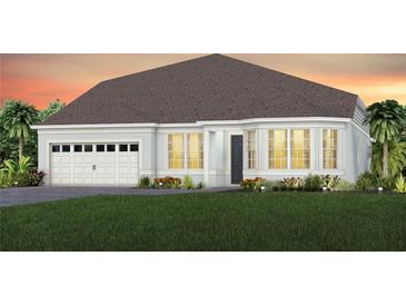 Charming one-story home with a two-car garage, lush landscaping and a well-maintained lawn at 15148 Willow Ridge Dr, Montverde, FL 34756