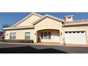 Charming villa with a one car garage, and quaint front porch perfect for relaxing at 2611 Shantiniketan Blvd # G-11, Tavares, FL 32778