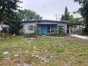 Charming single-story home featuring a neatly maintained yard and a welcoming blue front door at 2838 Wright Ave, Winter Park, FL 32789