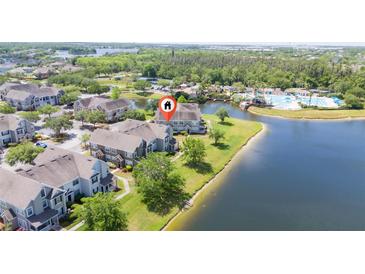 Beautiful waterfront townhomes featuring a community pool and lush landscaping, all with lake access at 8997 Lee Vista Blvd # 2009, Orlando, FL 32829