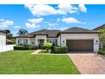 Charming single-story home with well-maintained landscaping and brick paver driveway at 2795 Westyn Cove Ln, Ocoee, FL 34761