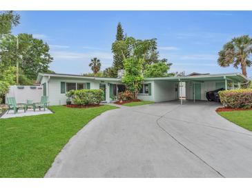 Charming single-story home with a well-manicured lawn and covered parking at 4436 Larado Pl, Orlando, FL 32812
