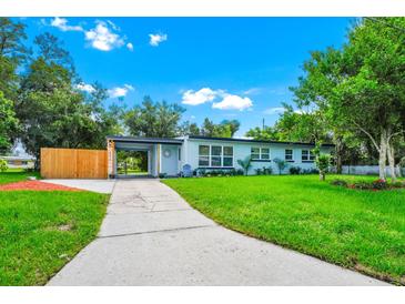 Charming single-story home featuring a well-manicured lawn and a covered entry, exuding curb appeal at 511 S Alder Ave, Orlando, FL 32807