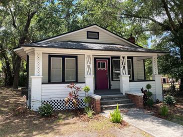 Charming single-story home with a cozy front porch and neatly landscaped yard at 2504 Yale Ave, Sanford, FL 32773
