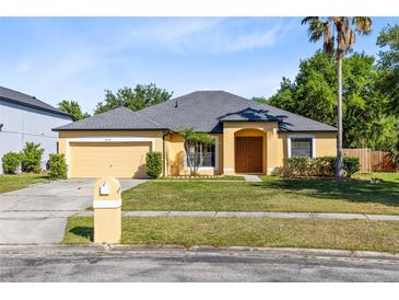 Charming one-story home with a two car garage, and a well-maintained landscaped front yard at 19319 Briercrest Trl, Orlando, FL 32833