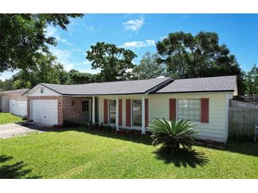 Charming single-story home featuring a well-maintained front lawn, brick accents, and a cozy, welcoming facade at 808 Woodling Pl, Altamonte Springs, FL 32701