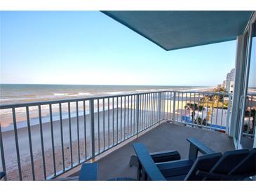 Relax on the private balcony, complete with seating, offering stunning oceanfront views of the beach at 5203 S Atlantic Ave # 416B, New Smyrna Beach, FL 32169