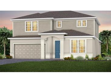 Charming two-story home featuring a blue front door, neutral siding, and attached two-car garage at 5604 Wood Bridge Pl, St Cloud, FL 34771