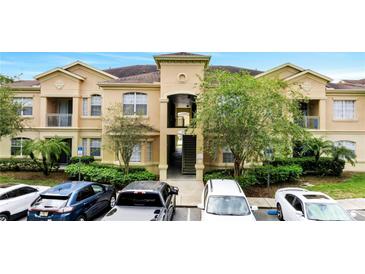 Inviting two-story condo with well-maintained landscaping and ample parking at 505 Terrace Ridge Cir # 505, Davenport, FL 33896