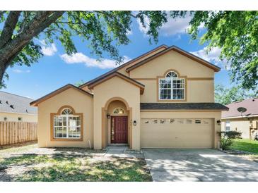 Charming two-story home featuring a well-manicured lawn and a classic architectural design at 466 Drexel Ridge Cir, Ocoee, FL 34761