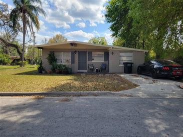 Charming single-story home featuring a well-maintained front yard, mature trees, and a driveway with parking at 530 Ruffel St, Maitland, FL 32751