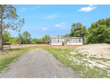 Well-maintained single-Gathering home surrounded by beautiful mature trees at 9055 Atlas Dr, St Cloud, FL 34773