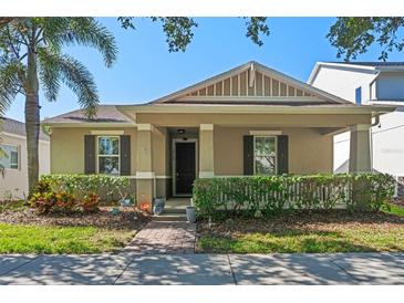 Charming single-story home with a manicured front yard and inviting covered porch at 14738 Porter Rd, Winter Garden, FL 34787