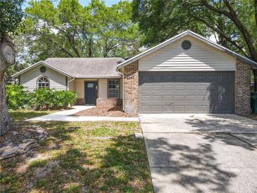 Charming single-story home featuring a two-car garage and well-maintained landscaping at 2647 Lake Landing Blvd, Eustis, FL 32726