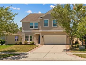 Charming two-story home with a well-manicured lawn and a spacious two-car garage at 528 Seven Oaks Blvd, Winter Springs, FL 32708