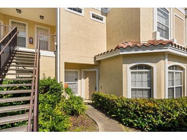Inviting exterior view of unit 102 with well-manicured landscaping at 676 Sandy Neck Ln # 102, Altamonte Springs, FL 32714