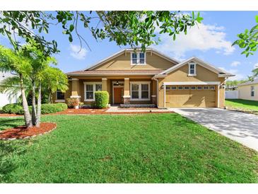 Charming single-Gathering home featuring a well-manicured lawn and attached two car garage at 3281 Pawleys N Loop, St Cloud, FL 34769