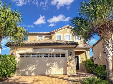 Charming two-story home with well-maintained landscaping and a spacious two car garage at 8961 Rhodes St, Kissimmee, FL 34747