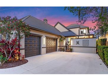 Charming home with a large three-car garage and meticulously maintained landscaping and a tile roof at 9624 Bryanston Dr, Orlando, FL 32827