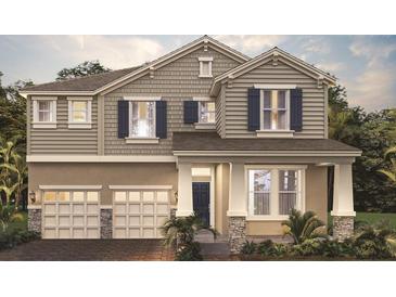 Charming two-story home featuring a 2-car garage, neutral siding, and inviting curb appeal at 16195 Point Rock Dr, Winter Garden, FL 34787