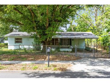 Modest single story home with fenced yard, mature tree and covered parking at 226 S Apollo Dr, Apopka, FL 32703