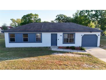 Charming single-story home with a well-maintained front yard and a cozy, inviting facade at 312 Oak Track Ter, Ocala, FL 34472