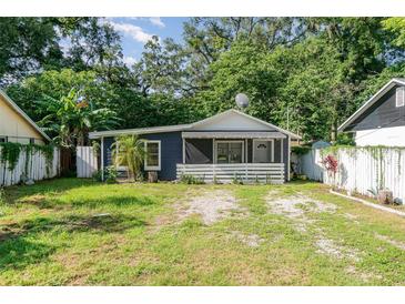 Charming single-story home with a cozy front porch and well-maintained lawn at 1506 37Th St, Orlando, FL 32839