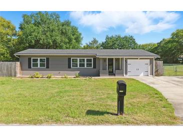 Charming single-story home with a well-maintained lawn, mailbox, and inviting curb appeal at 62 Magnolia Dr, Debary, FL 32713