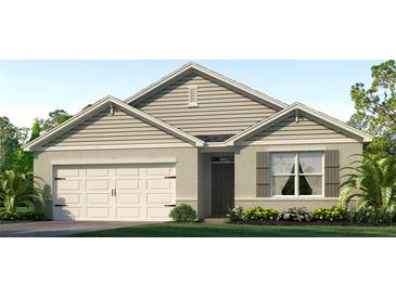 Charming single-story home with a well-manicured lawn and attached two-car garage at 1015 Morfontaine St, Daytona Beach, FL 32124