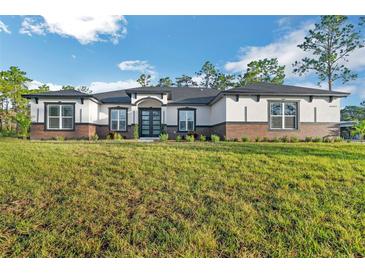 Beautiful new construction home with a well-manicured lawn and craftsman architectural details at 5531 Dallas Blvd, Orlando, FL 32833
