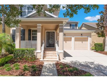 Charming home showcasing a welcoming entrance and well-manicured landscaping at 9963 Hartford Maroon Rd, Orlando, FL 32827