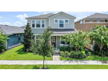 Charming two-story home with landscaped front yard and welcoming entryway at 16274 Taliesin St, Winter Garden, FL 34787