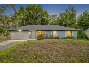 Charming single-story home with a well-manicured lawn and cozy, inviting curb appeal at 275 W 4Th St, Chuluota, FL 32766