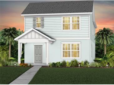 Charming two-story home with light blue exterior and well-manicured landscaping with tropical trees at 5032 Starling Bird Ln, St Cloud, FL 34771