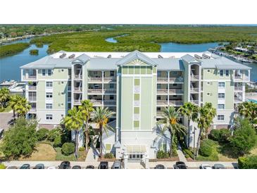Stunning waterfront condominium complex boasts manicured landscaping, covered parking, and access to coastal waterways at 5 Riverwalk Dr # 604, New Smyrna Beach, FL 32169