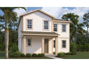 Charming two-story home with a welcoming front porch and beautifully landscaped front yard, showcasing curb appeal at 2389 Zuni Road, St Cloud, FL 34771