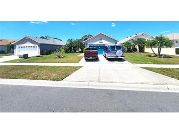 Charming single-Gathering home with well-maintained lawn and large driveway at 2426 Hybrid Dr, Kissimmee, FL 34758