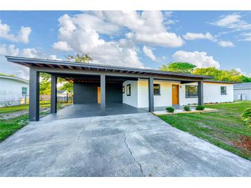 Charming single-story home featuring a spacious carport and a well-maintained front yard at 2614 Rio Ln, Orlando, FL 32805