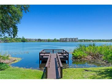 Expansive lake view from the end of a wooden private dock on a bright day at 1152 Grove St, Maitland, FL 32751