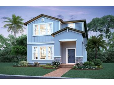 Charming two-story home with blue siding, stone accents, and a welcoming front porch at 17347 Beachgrass Aly, Winter Garden, FL 34787