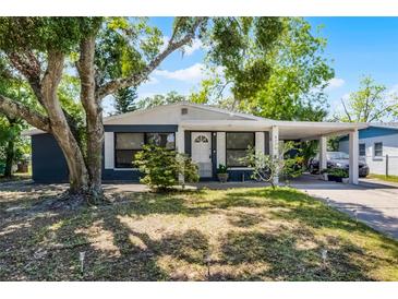 Charming single story home with mature trees and a covered carport at 4274 Tatum St, Orlando, FL 32811
