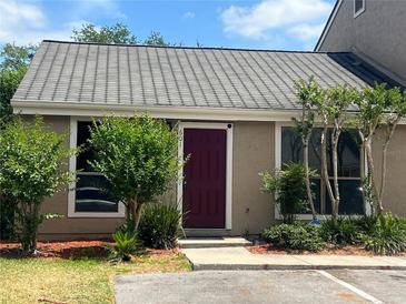 Charming home featuring a beautiful front door, well-maintained landscaping, and a welcoming entrance at 601 Casa Park Court B Ct, Winter Springs, FL 32708