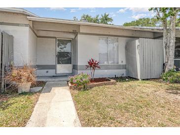 Charming front exterior featuring a well-manicured lawn and walkway leading to the front door at 1230 Westside Dr, Winter Garden, FL 34787