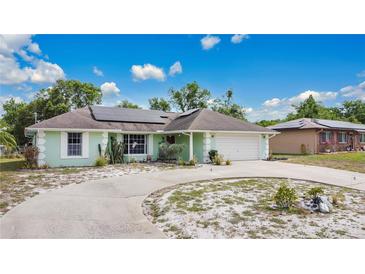 Inviting single-story home featuring well-maintained landscaping and solar panels at 432 Taylorville St, Deltona, FL 32725