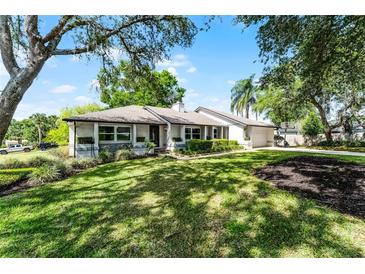 Charming single-story home boasts a well-manicured lawn and inviting curb appeal at 456 Willowbrook Ln, Longwood, FL 32779