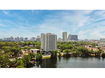 A high-rise condo offers stunning city views and a serene lake at 400 E Colonial Dr # 1003, Orlando, FL 32803