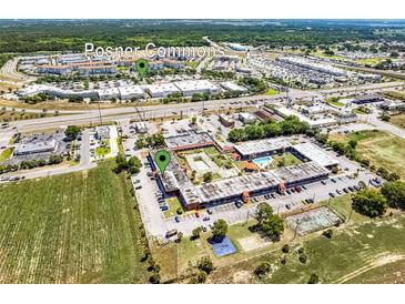 A captivating aerial shot showcases the complex near Posner Commons, highlighting convenient access to shopping and community amenities at 43420 Highway 27 # 121, Davenport, FL 33837