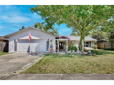 Charming single Gathering home with a two-car garage, beautiful landscaping, and lots of curb appeal at 623 Green Meadow Ave, Maitland, FL 32751