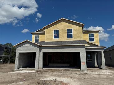 New two story home featuring a spacious layout and attached two-car garage at 1157 Basalt Ln, Sanford, FL 32771